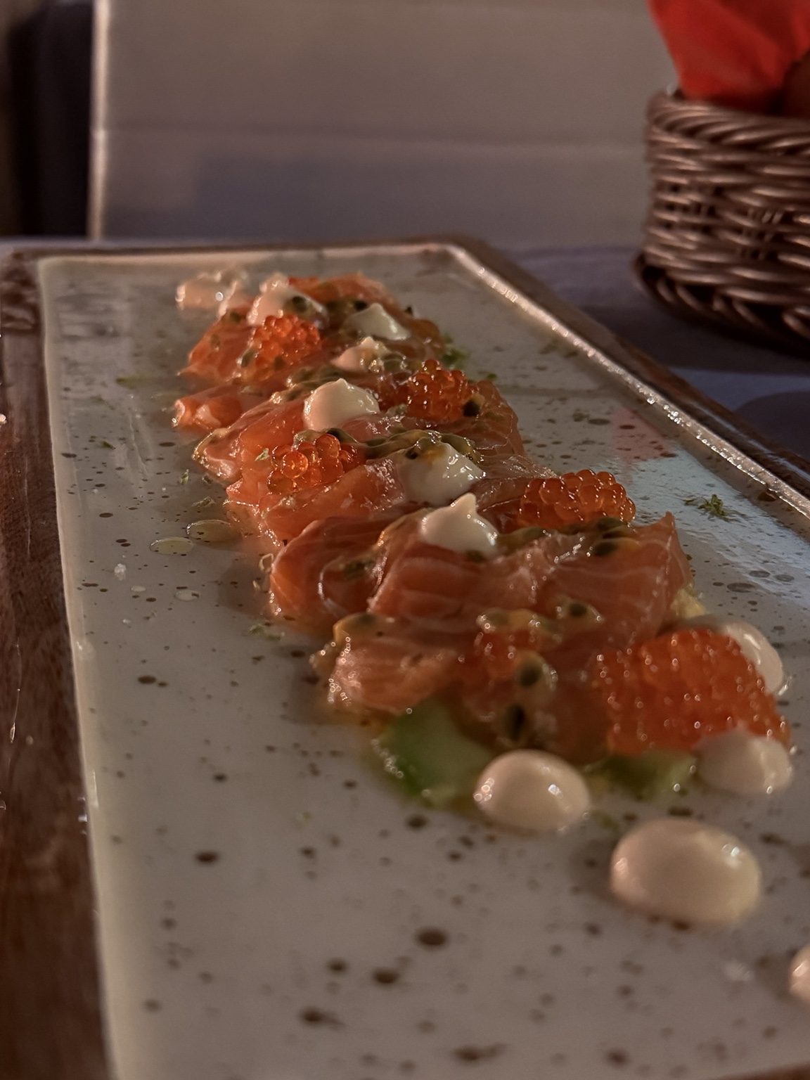 Salmon with passion fruit, roe and herb cream